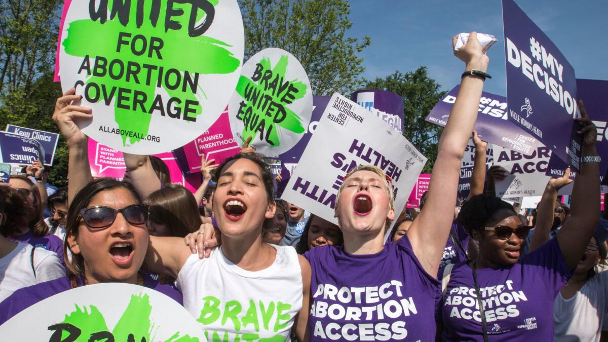 Abortion rights activists rejoice in front of the U.S. Supreme Court in Washington, as the justices strike down parts of a Texas anti-abortion restriction law known last year.