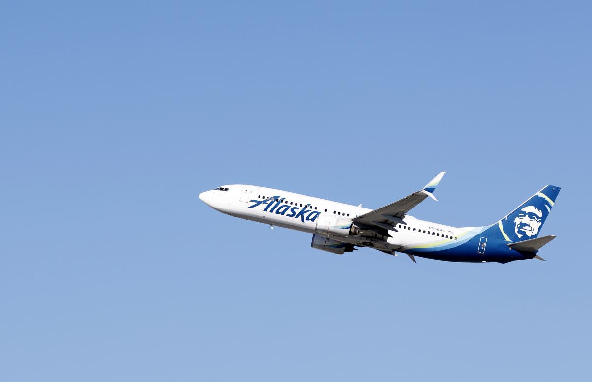 An Alaska Airlines flight takes off from Los Angeles International Airport on January 8, 2024. 