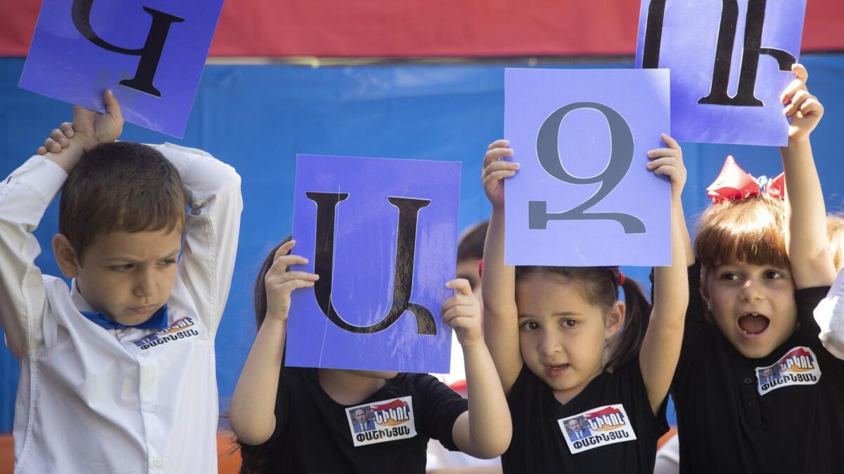 Los Angeles Times reporter Esmeralda Bermudez is raising her daughter to be trilingual. The 5-year-old girl, second from right, sang songs and recited poems in Armenian at her Armenian school's end-of-the-year celebration.