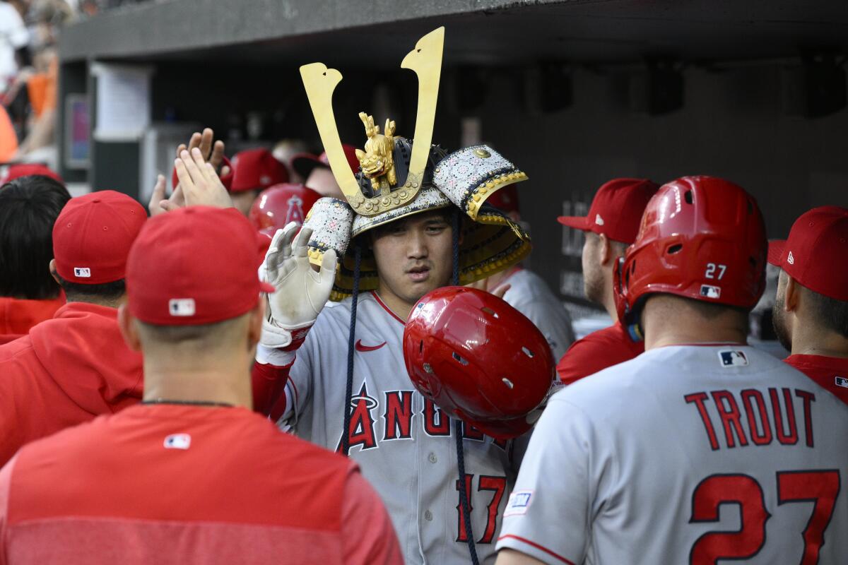 Angels' Shohei Ohtani celebrates after his three-run home run during the fourth inning against the Baltimore Orioles.