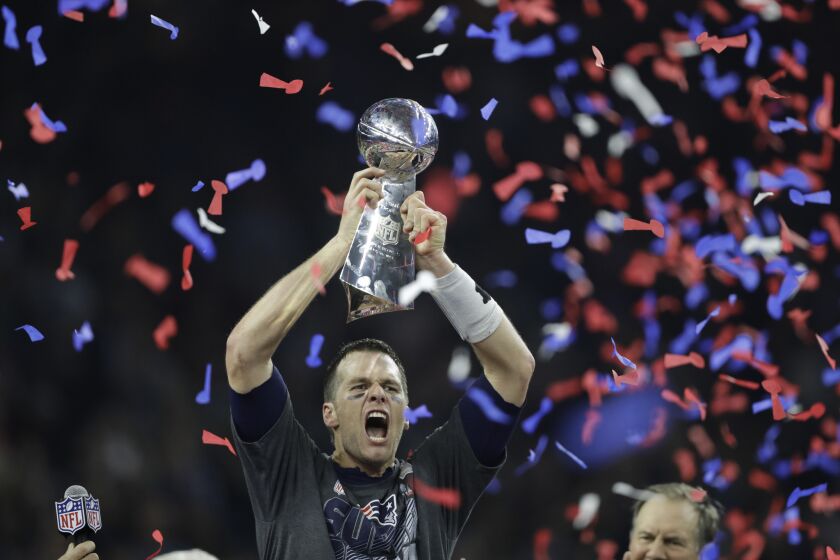Quarterback Tom Brady celebrates after the Patriots defeated the Falcons, 34-28, in overtime at Super Bowl LI.