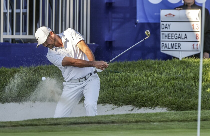 Jason Day hits out of a greenside bunker at South's 18th hole during Friday's third round of the Farmers Insurance Open.
