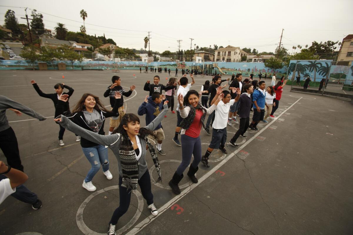 Eighth-grade students work out at Logan Street Elementary School in Echo Park. A new study finds that American adolescents get the bulk of their exercise at school, but still fall short of official targets for physical activity.