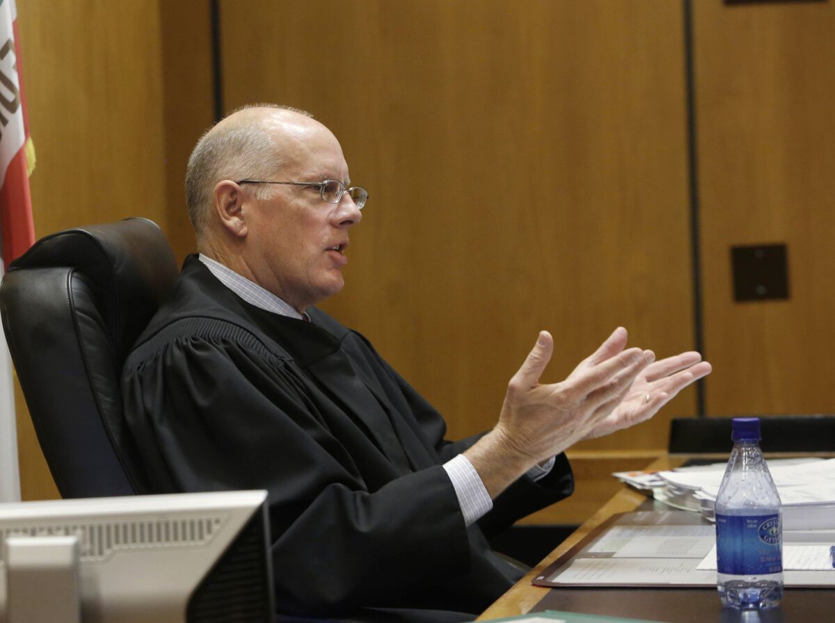Sacramento County Superior Court Judge Michael Kenny questions attorney Stuart Flashman, who is representing opponents of California's high-speed rail project, about the lawsuit seeking to halt funding for the bullet train on the grounds that the project violates promises made to voters.