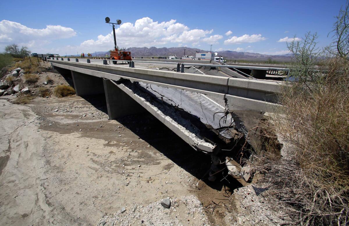 Damage is seen from a washed out bridge near the town of Desert Center, Calif., along Interstate I-10, on July 20. All traffic along one of the major highways connecting California and Arizona was blocked when the bridge over a desert wash collapsed during a major storm, and the roadway in the opposite direction sustained severe damage.