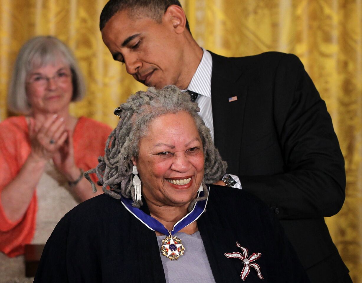 Toni Morrison receives the Presidential Medal of Freedom from President Obama in 2012.