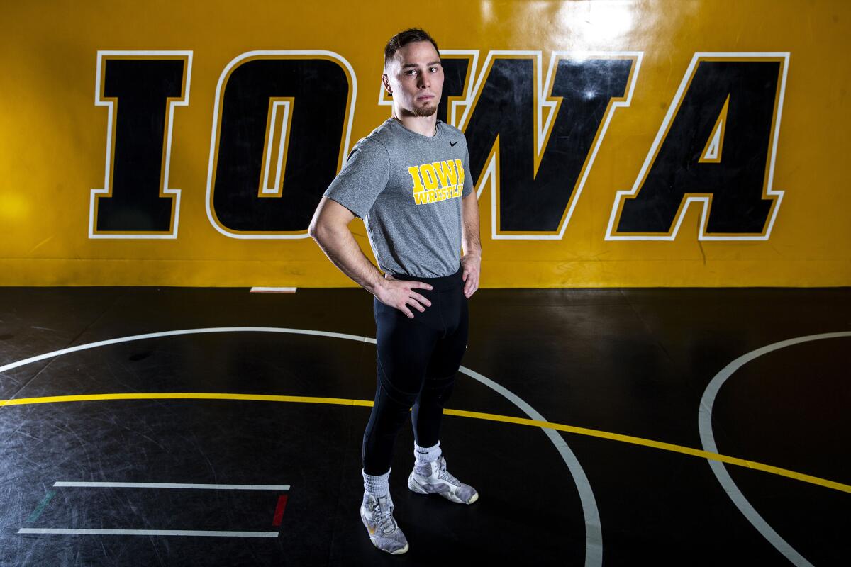 FILE - Iowa's Spencer Lee poses for a photo during an NCAA college wrestling media day Thursday, Oct. 27, 2022, in Iowa City, Iowa. Spencer Lee is back for a sixth season and trying to become the first four-time national champion in the program's proud history. (Joseph Cress/Iowa City Press-Citizen via AP, File)