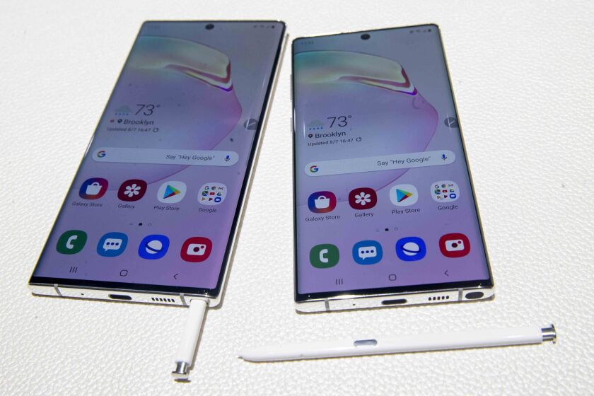 FILE - This Aug. 7, 2019 file photo shows the Samsung Galaxy Note 10, right, and the Galaxy Note 10 Plus on display during a launch event in New York. If you’re among the “early adopters” who need to be first on the block for every technological advancement, you’ll need a 5G phone with Android. Samsung, Motorola, LG and OnePlus are among the companies that already have 5G models using Google’s operating system. Apple isn’t expected to release a 5G iPhone until next year. (AP Photo/Mary Altaffer, File)