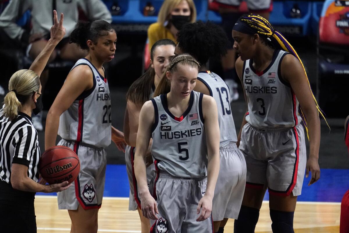 Connecticut guard Paige Bueckers (5) reacts after getting fouled during the second half of a women's Final Four NCAA college basketball tournament semifinal game against Arizona Friday, April 2, 2021, at the Alamodome in San Antonio. (AP Photo/Eric Gay)