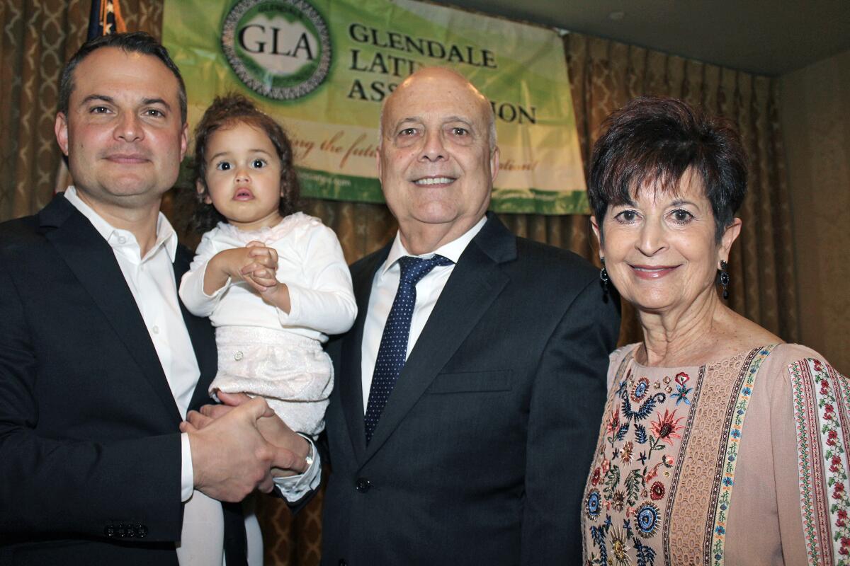 Glendale Latino Assn. honorees are, from right, Karen Swan and Frank Quintero. Accompanying are Quintero’s son Frank Quintero IV and granddaughter Sunny, 2 years old.