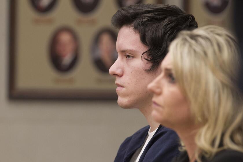 John T. Earnest, next to Public Defender's Office investigator Dana Gary, listened on Friday during the second day of his preliminary hearing in San Diego Superior Court on charges related to the April 27 shootings at Chabad of Poway. A judge bound him over for trial on charges of murder, attempted murder and arson.