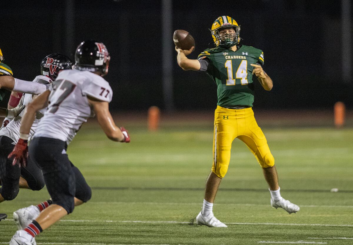 Edison's Parker Awad throws a pass under pressure during a game against Palos Verdes at Westminster High on Thursday.