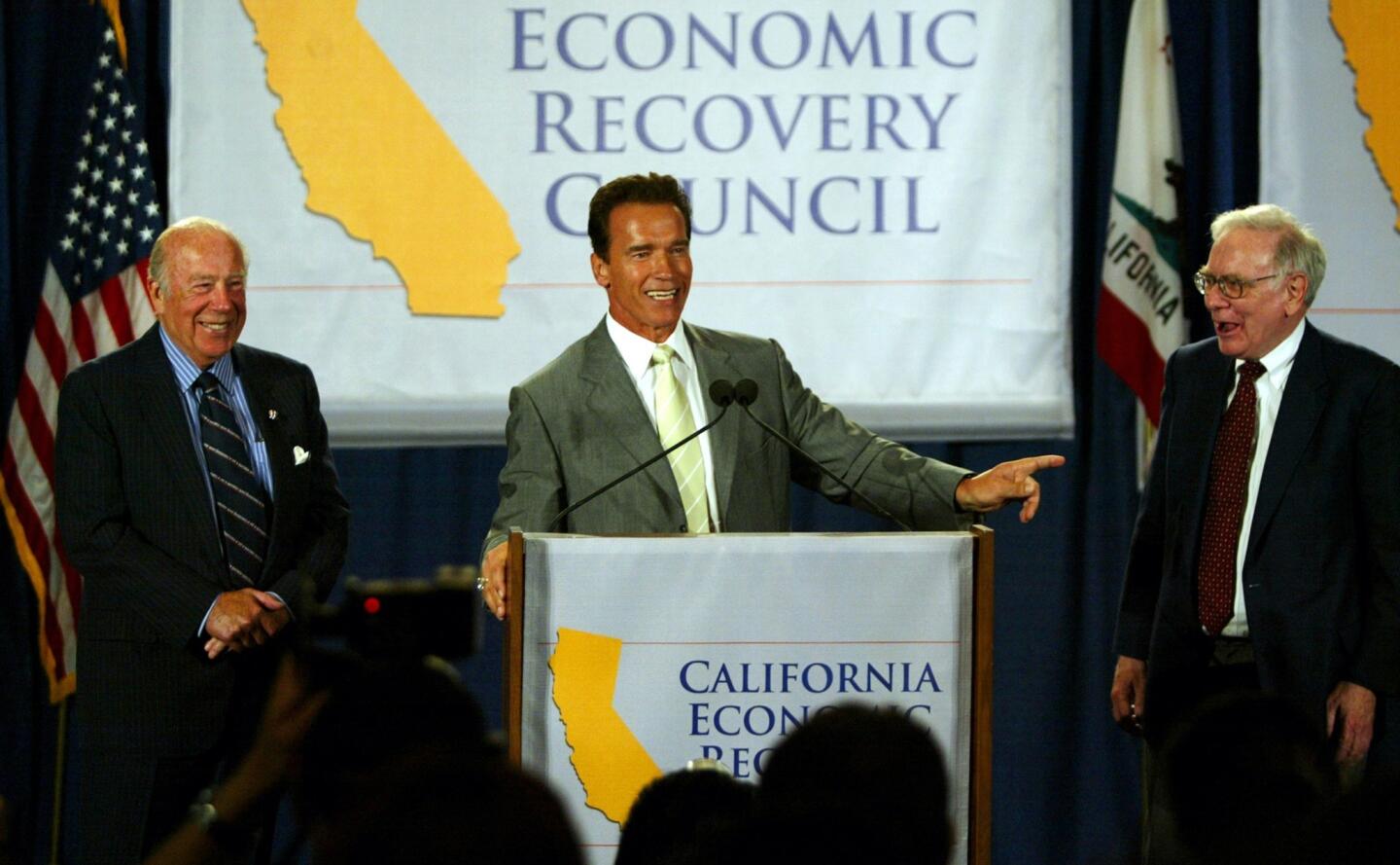 Arnold Schwarzenegger with George Schultz and Warren Buffett