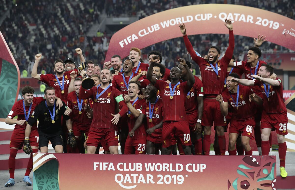 Members of Liverpool celebrate after winning the Club World Cup final over Flamengo on Dec. 21 at Khalifa International Stadium.