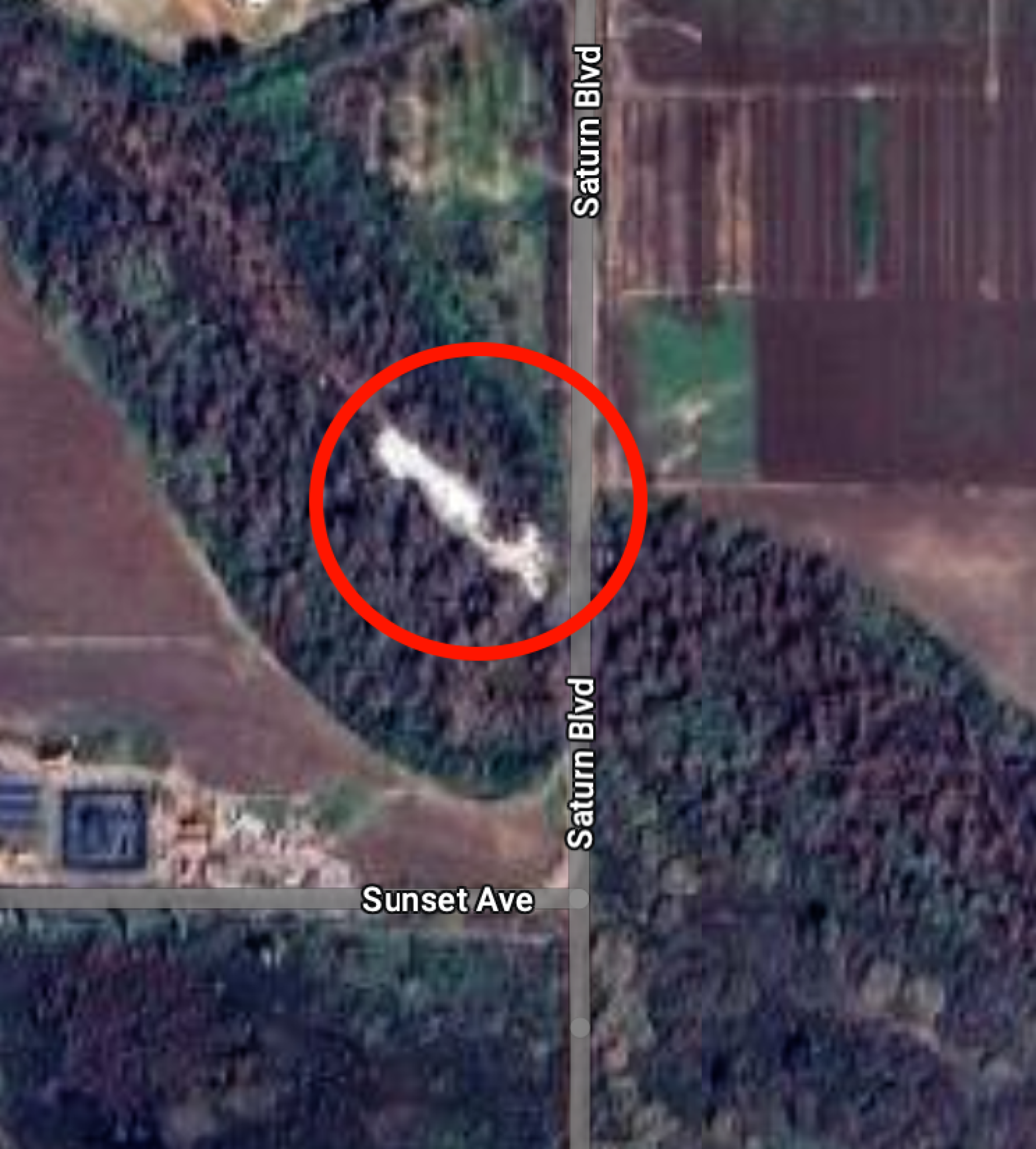 A satellite image from Google shows white foam next to Saturn Boulevard