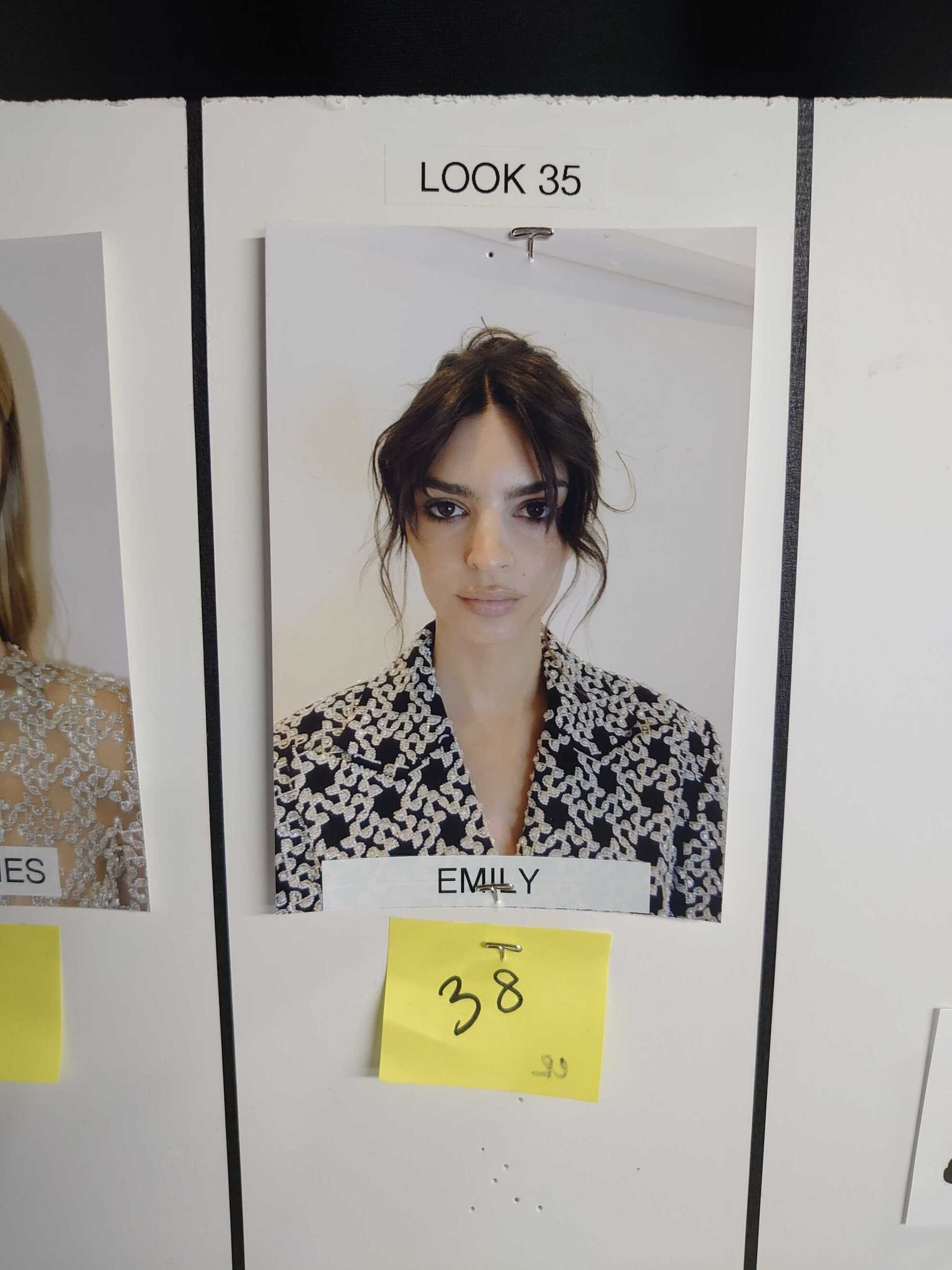 A Polaroid style headshot photo of Emily Ratajkowski on a modeling board