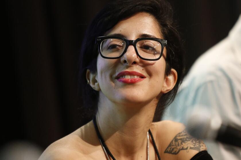 Porochista Khakpour smiles during the Fiction: On the Fringe panel at the 20th Los Angeles Times Festival of Books at USC on Sunday, April 19, 2015 in Los Angeles, Calif. (Patrick T. Fallon/ For The Times)