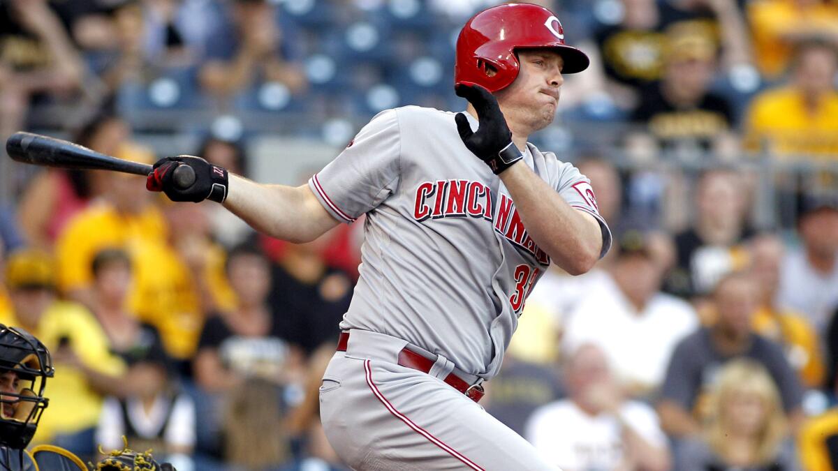 Reds right fielder Jay Bruce delivers a run-scoring single against the Pirates during a game June 23 in Pittsburgh.