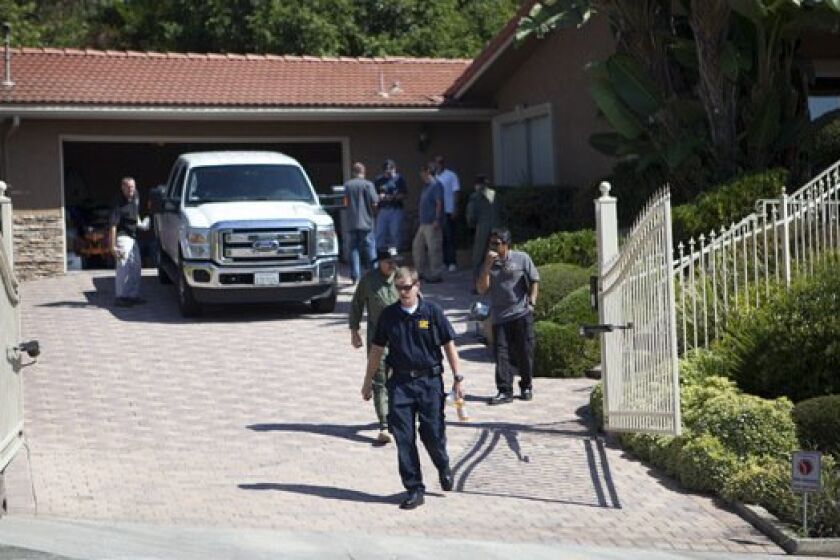 ATF and San Diego Fire Department Bomb Squad members outside a 5091 sq ft. home at 5983 Madra Avenue in Del Cerro.