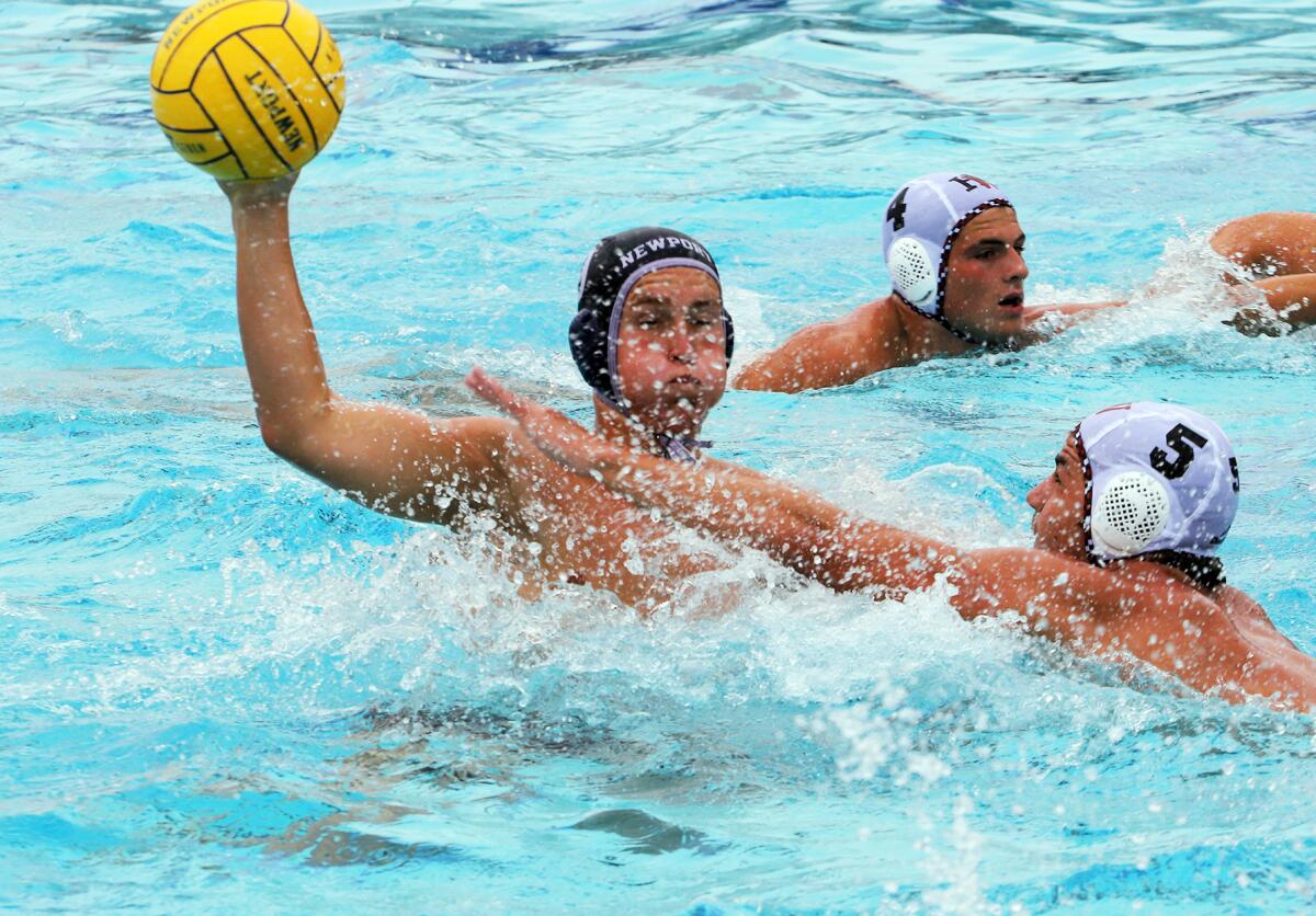 Newport Harbor's Weston Hartel (9) makes a pass against Harvard-Westlake during the South Coast Tournament semifinals.