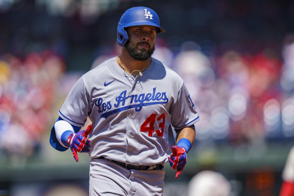 Los Angeles Dodgers' Edwin Rios reacts to his home run during a baseball game.