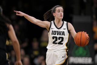 Iowa guard Caitlin Clark (22) directs the team on offense during the second half.