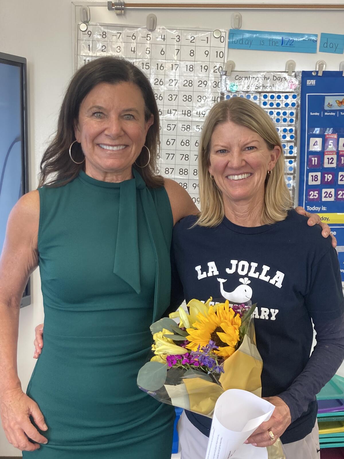 Merino with La Jolla Elementary School Teacher of the Year Nancy Rice.