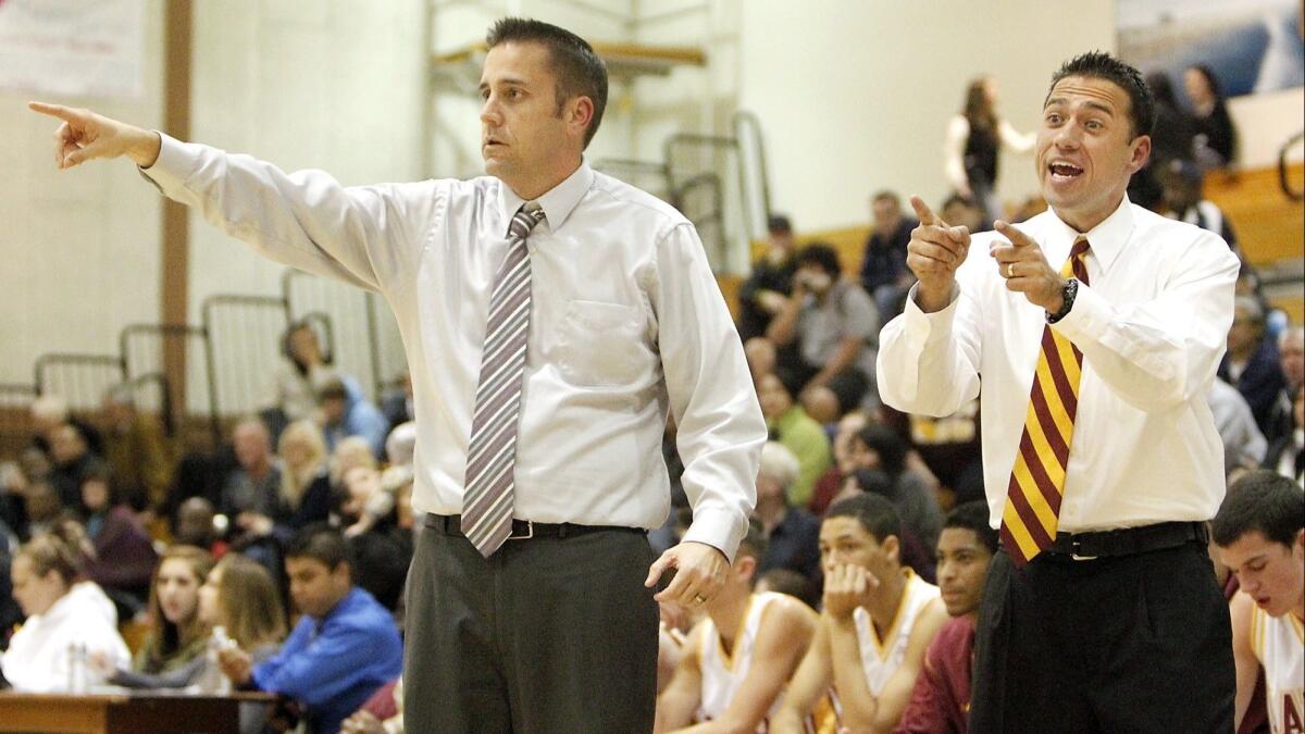 Jimmy Harris, right, pictured coaching with Tim Walsh, left, on Dec. 6, 2011, led the Ocean View High boys' basketball team to a season-opening win on Tuesday.