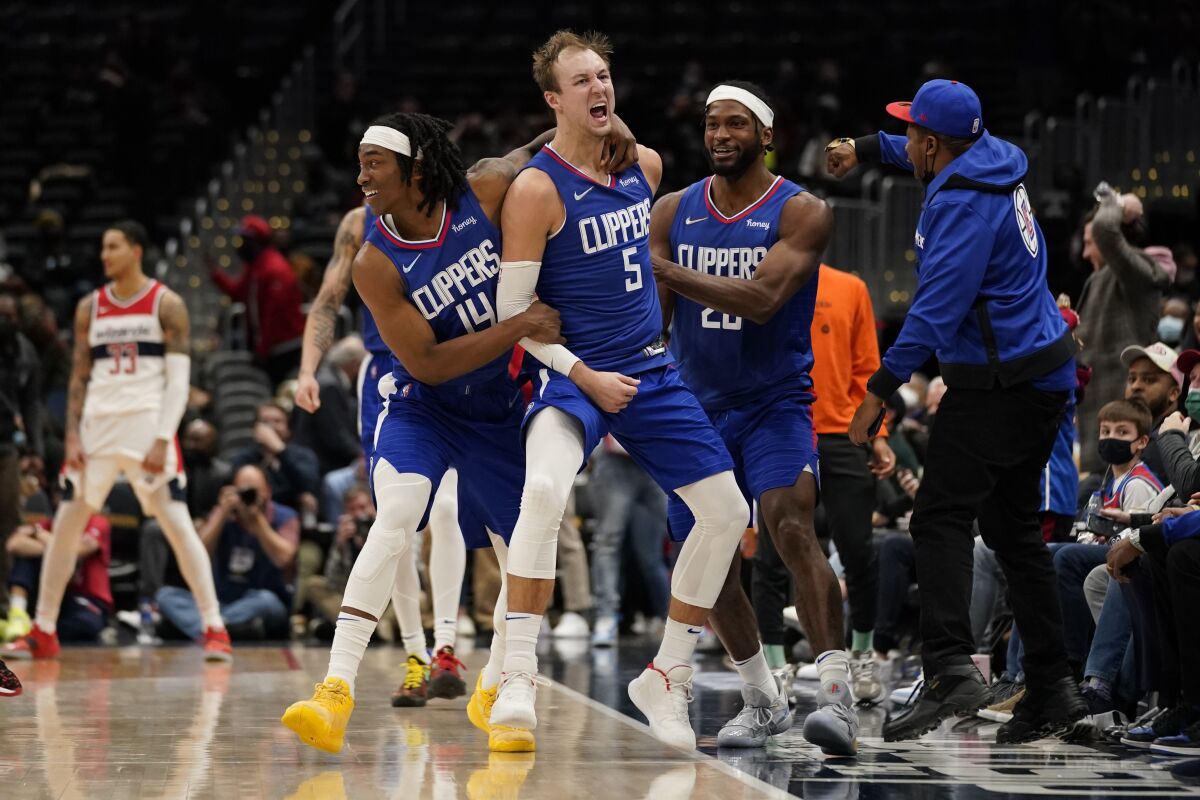 Clippers guard Luke Kennard (5) celebrates after hitting the game-tying shot in the closing seconds of a 116-115 win.