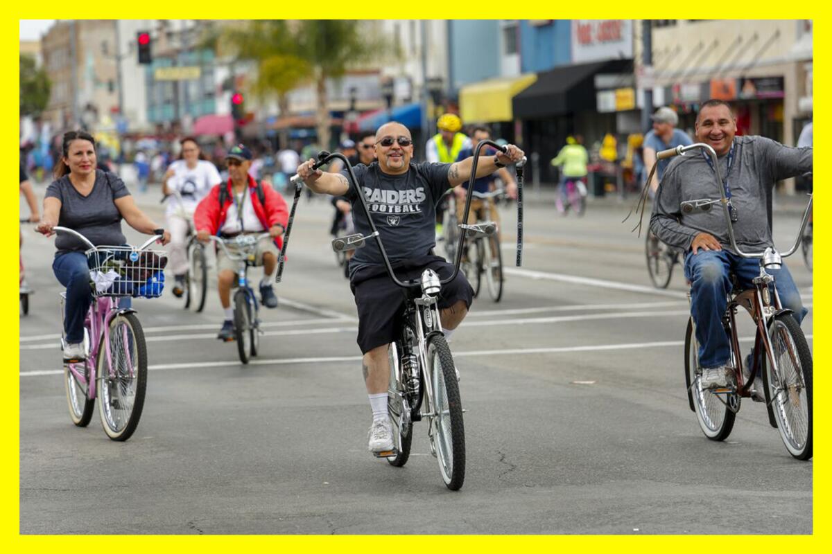 Bike riders spread out on a street.