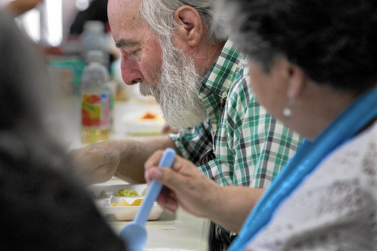 Gary Harrison, 68, enjoys lunch at the Oldtimers Foundation in Huntington Park. The nonprofit's finances are in such disarray that it is in danger of losing its $2-million-a-year contract with Los Angeles County.