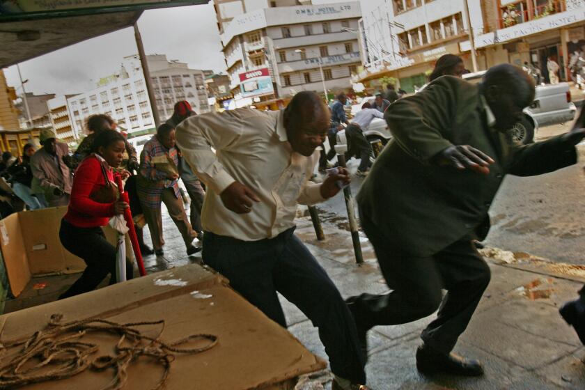 Protesters flee as Kenyan police use tear gas and fire live rounds to disperse a rally in the capital, Nairobi. Thousands of Raila Odinga's supporters clashed with police in several cities, defying a ban on protests.