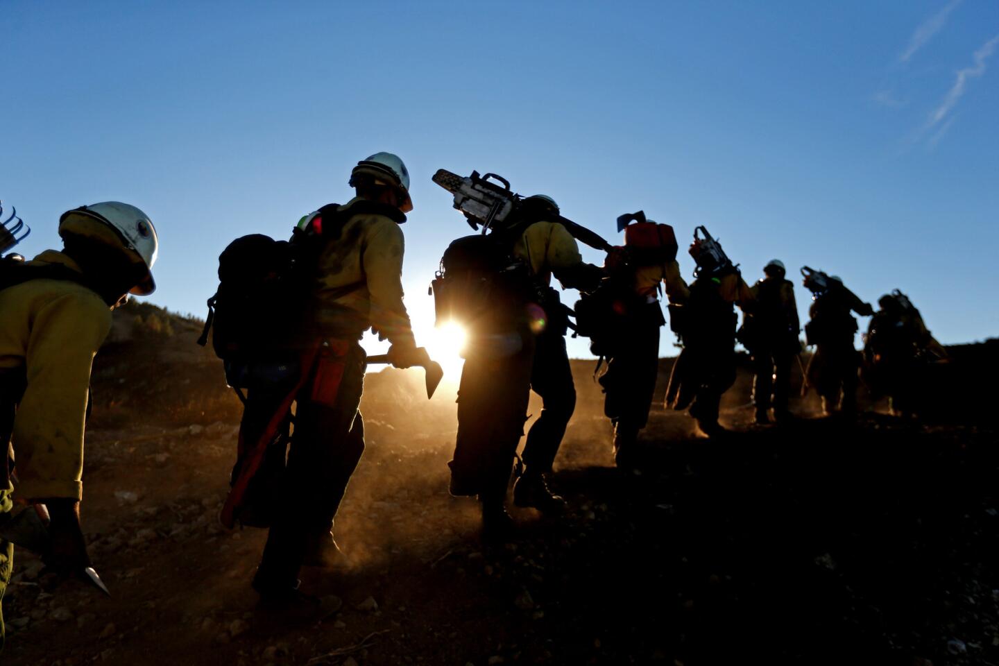 U.S. Forest Service hotshots hike back to a lookout tower after battling the Soberanes fire in Los Padres National Forest in Monterey County.