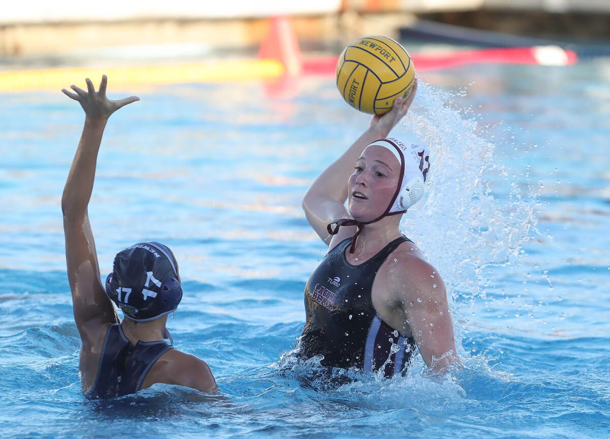 Ava Knepper (12) of Laguna Beach shoots over Newport Harbor's Valery Verdugo (17) during Tuesday's Surf League match.