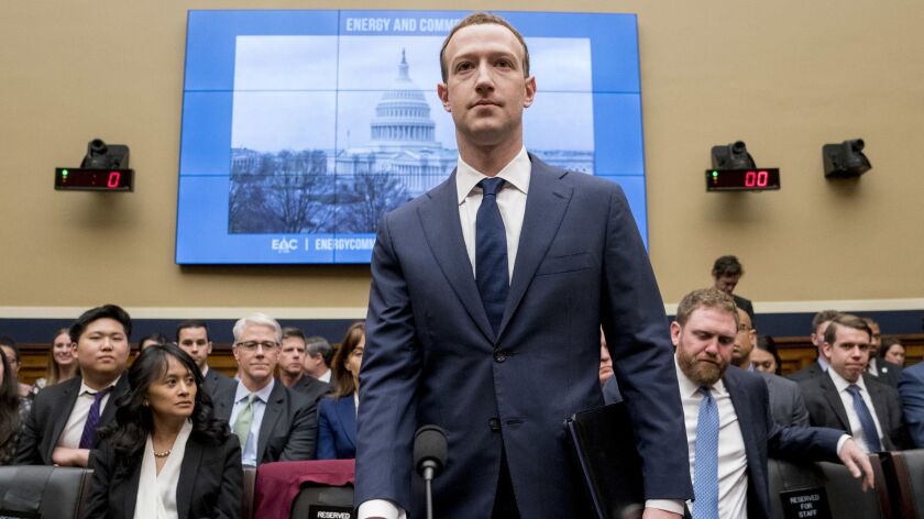 Facebook CEO Mark Zuckerberg arrives to testify before a House committee hearing April 11 about the use of the company's data to target American voters in the 2016 election. (AP Photo/Andrew Harnik)