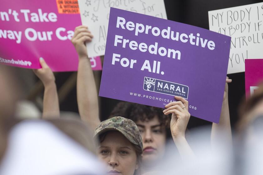 Anti-abortion protestors rally outside of the Georgia State Capitol following the signing of HB 481, in Atlanta, Tuesday, May 7, 2019. Georgia Governor Brian Kemp signed legislation on Tuesday banning abortions once a fetal heartbeat can be detected. (Alyssa Pointer/Atlanta Journal-Constitution via AP)