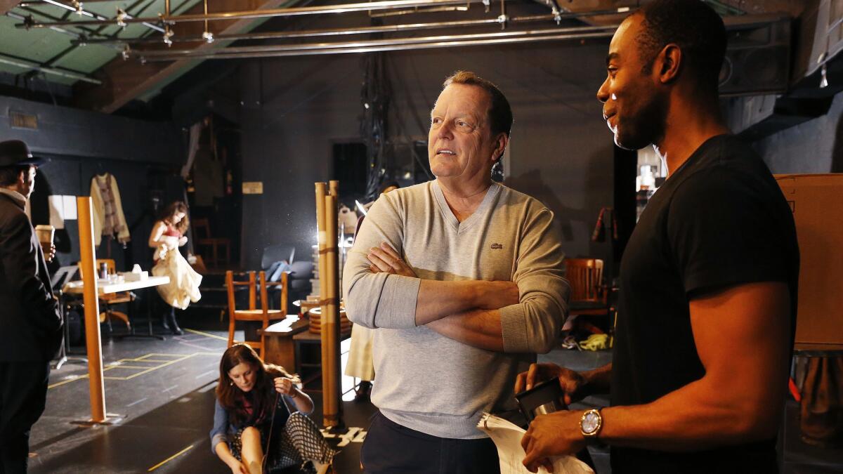 In rehearsal for "Ragtime" at the Pasadena Playhouse, director David Lee, left, talks with Clifton Duncan, who portrays a wronged ragtime piano player.
