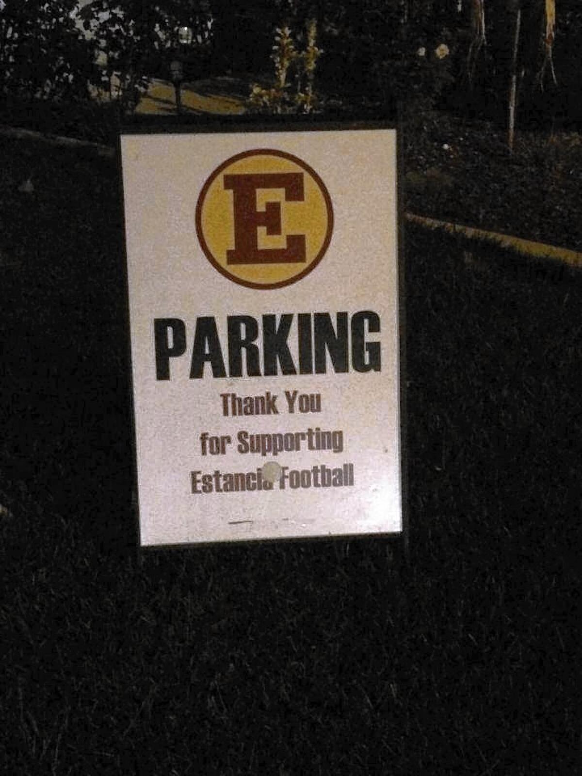 Costa Mesa police have arrested four students, two from Costa Mesa High School, in connection to an Oct. 17 vandalism against Mesa football Coach Glen Fisher's house. The suspects left behind this Estancia High School parking sign at Fisher's house and threw eggs at the residence.