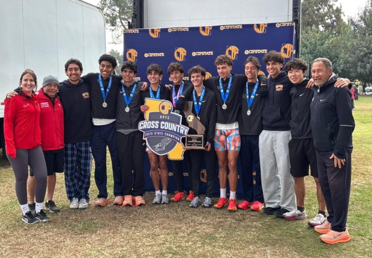Redondo Union's cross-country team poses for a group photo after winning the Division 1 state cross-country title Saturday.