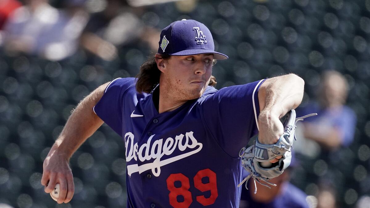 Dodgers pitcher Ryan Pepiot throws during a spring training game against the Texas Rangers in March.