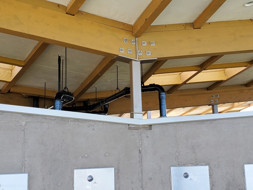 Some say the black piping in the Scripps Park Pavilion is visually jarring and should be repainted to blend in with the decor.