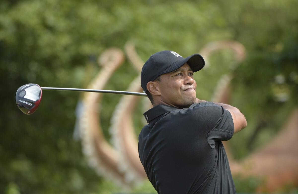 Tiger Woods watches his drive during the British Open on Friday.