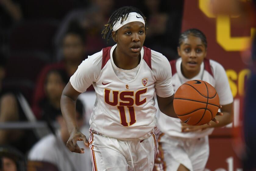 USC Trojans guard Aliyah Jeune dribbles the ball while playing the Virginia Cavaliers during an NCAA women's basketball game on Saturday, Nov. 9, 2019, in Los Angeles. (AP Photo/John McCoy)