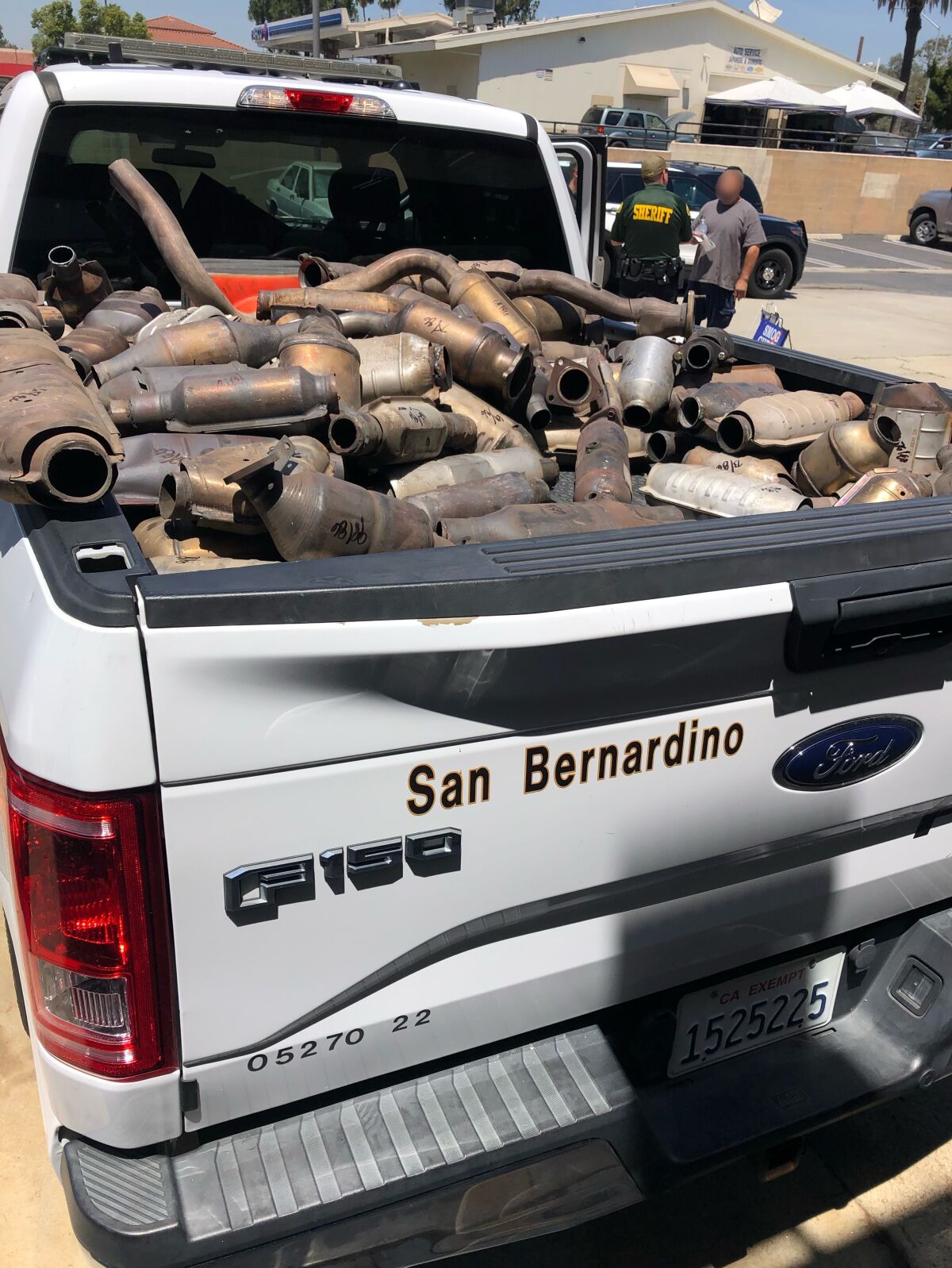 A truck bed filled with catalytic converters seized from Inland Empire businesses.