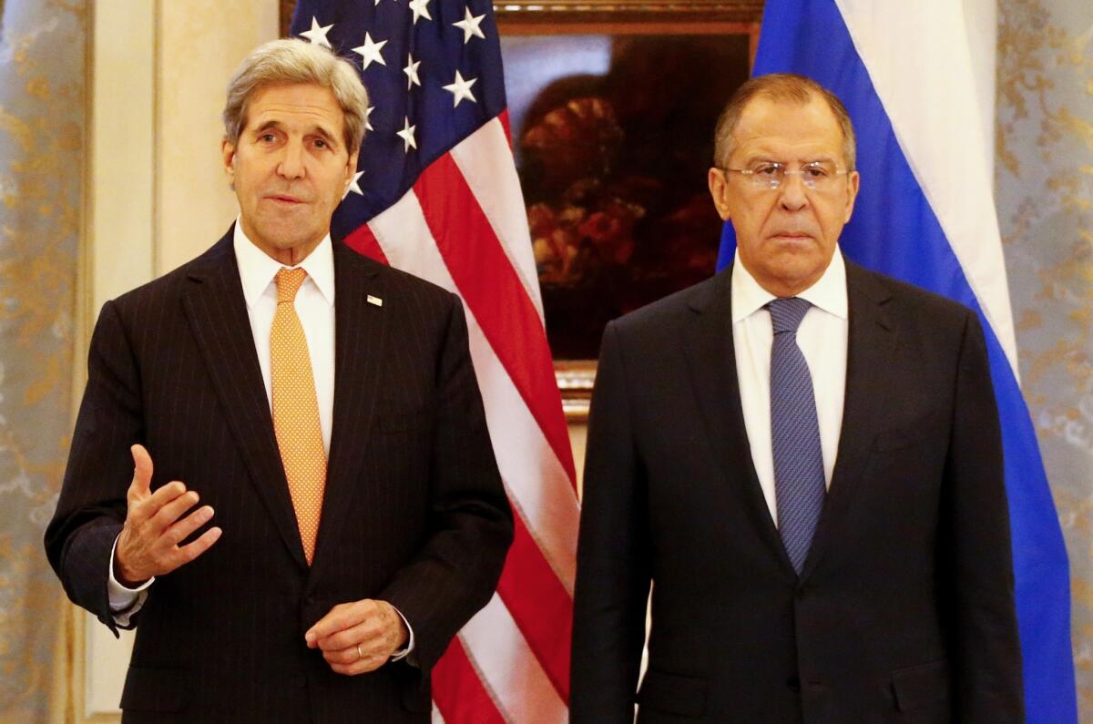 Russia's Foreign Minister Sergei Lavrov (R) and US Secretary of State John Kerry address the media before a conference on the Syria conflict in Vienna, Austria, on November 14, 2015.