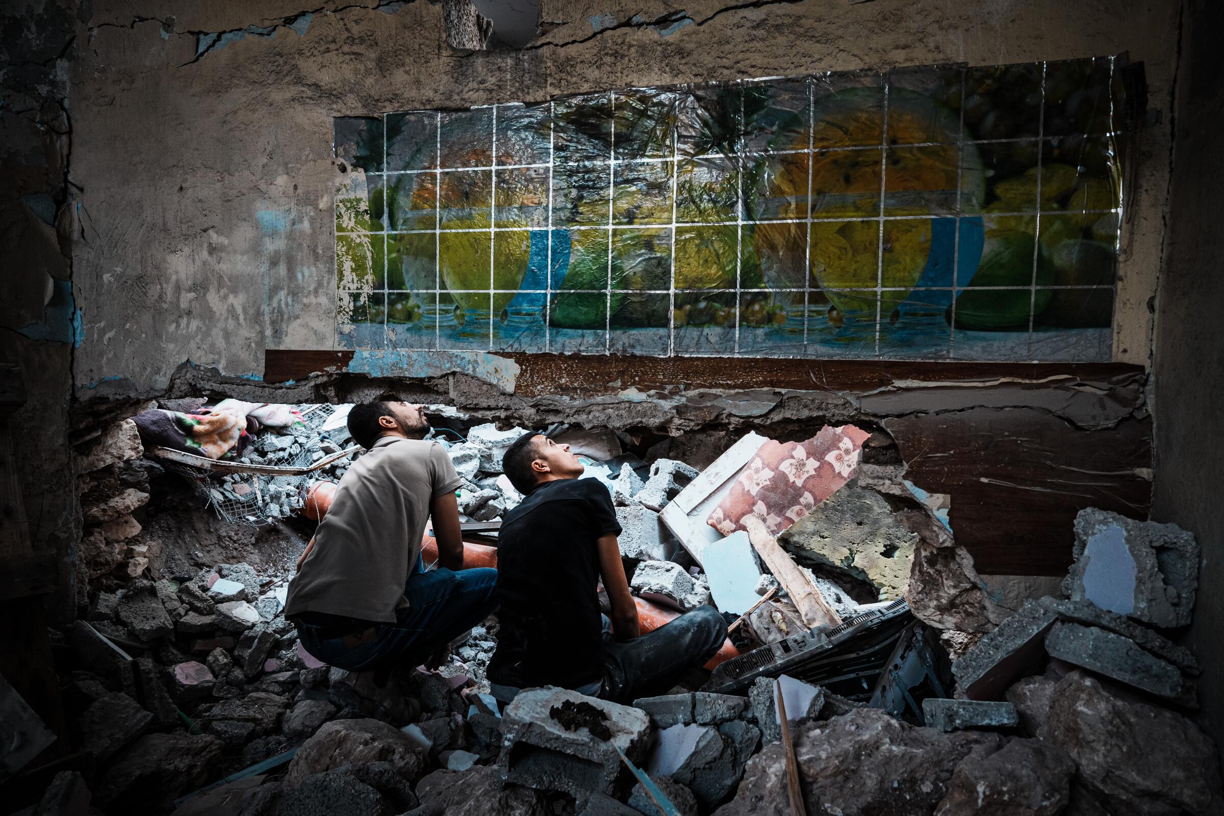 Residents of Jenin, in the West Bank, sifting through rubble in the aftermath of an Israeli airstrike