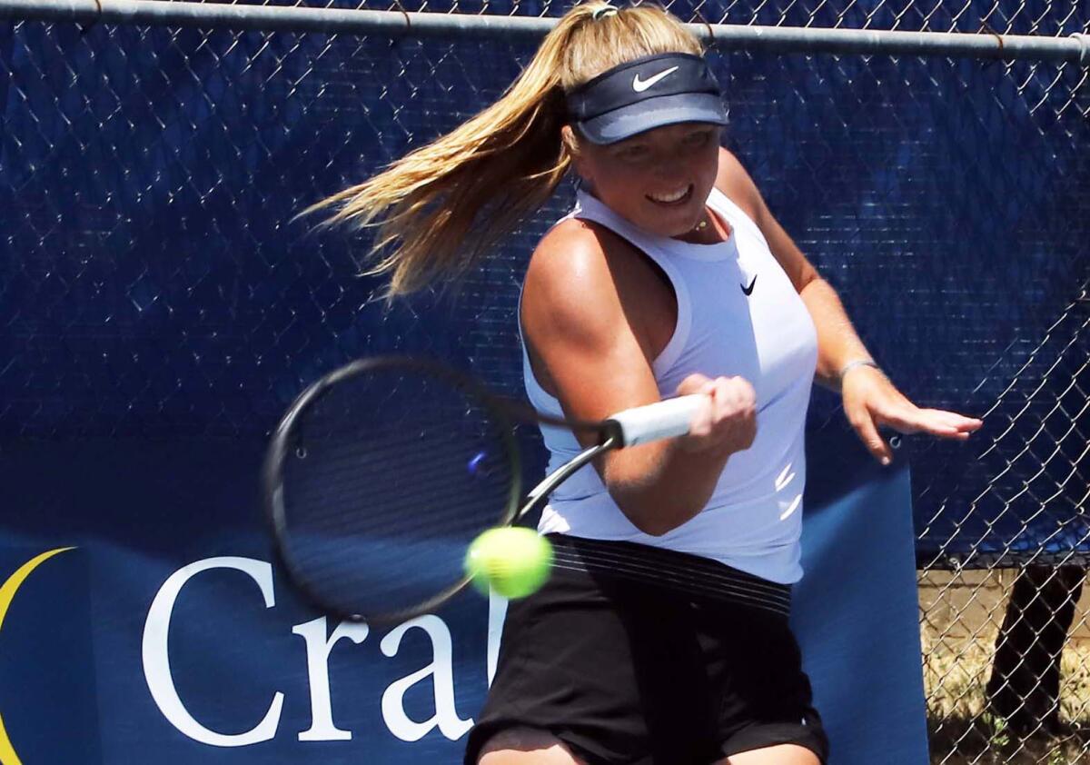 Laguna Beach native Kelly Keller returns a serve against Danielle Willson of Newport Beach during Wednesday's match.