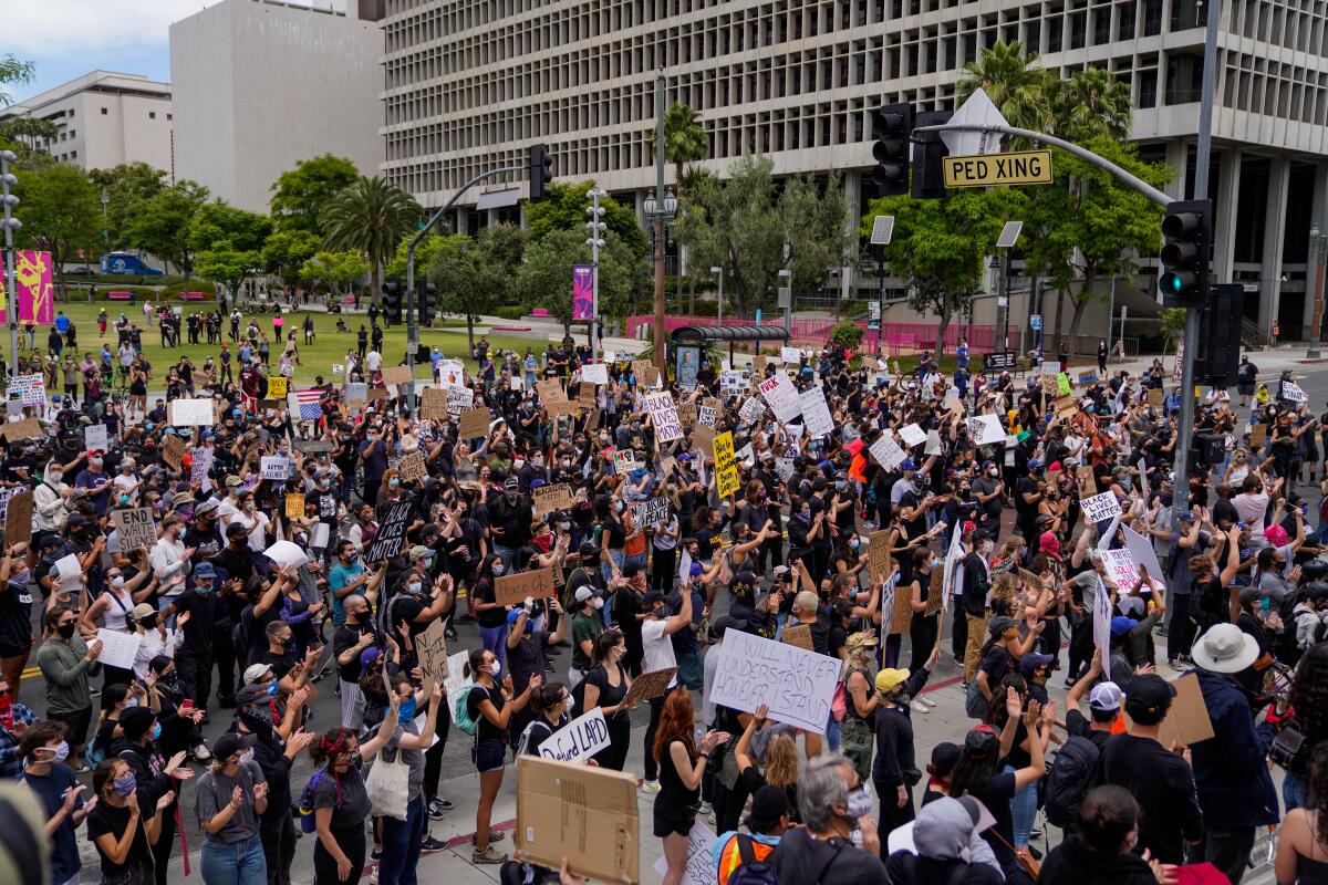 Protesters outside LA City Hall in downtown Los Angeles on Tuesday. 