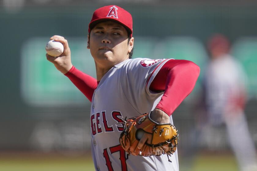 Los Angeles Angels' Shohei Ohtani pitches against the Oakland Athletics during the first inning.
