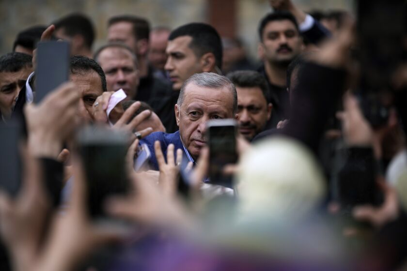 Turkish President and leader of the People Alliance party, presidential candidate Recep Tayyip Erdogan, leaves after he casted his ballot at a polling station in Istanbul, Turkey, Sunday, May 28, 2023. Erdogan, who has been at Turkey's helm for 20 years, is favored to win a new five-year term in the second-round runoff after coming just short of an outright victory in the first round on May 14. (AP Photo/Emrah Gurel)